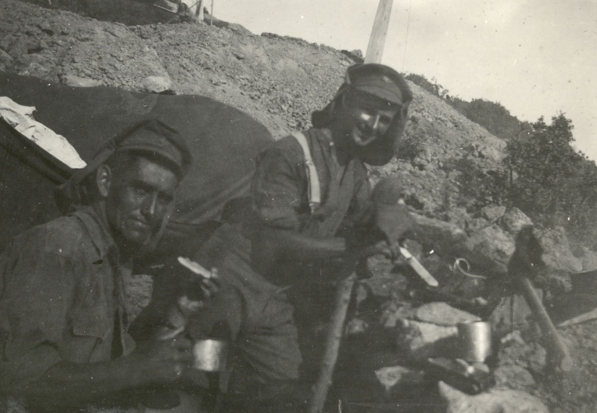 4/524 Lance Corporal David Kerr Haig and 9/803 Corporal Curll Alexander Gordon Catto having tea at No 2 Outpost, Gallipoli. Lance Corporal Haig looks to be about to eat a ubiquitous Army Biscuit
